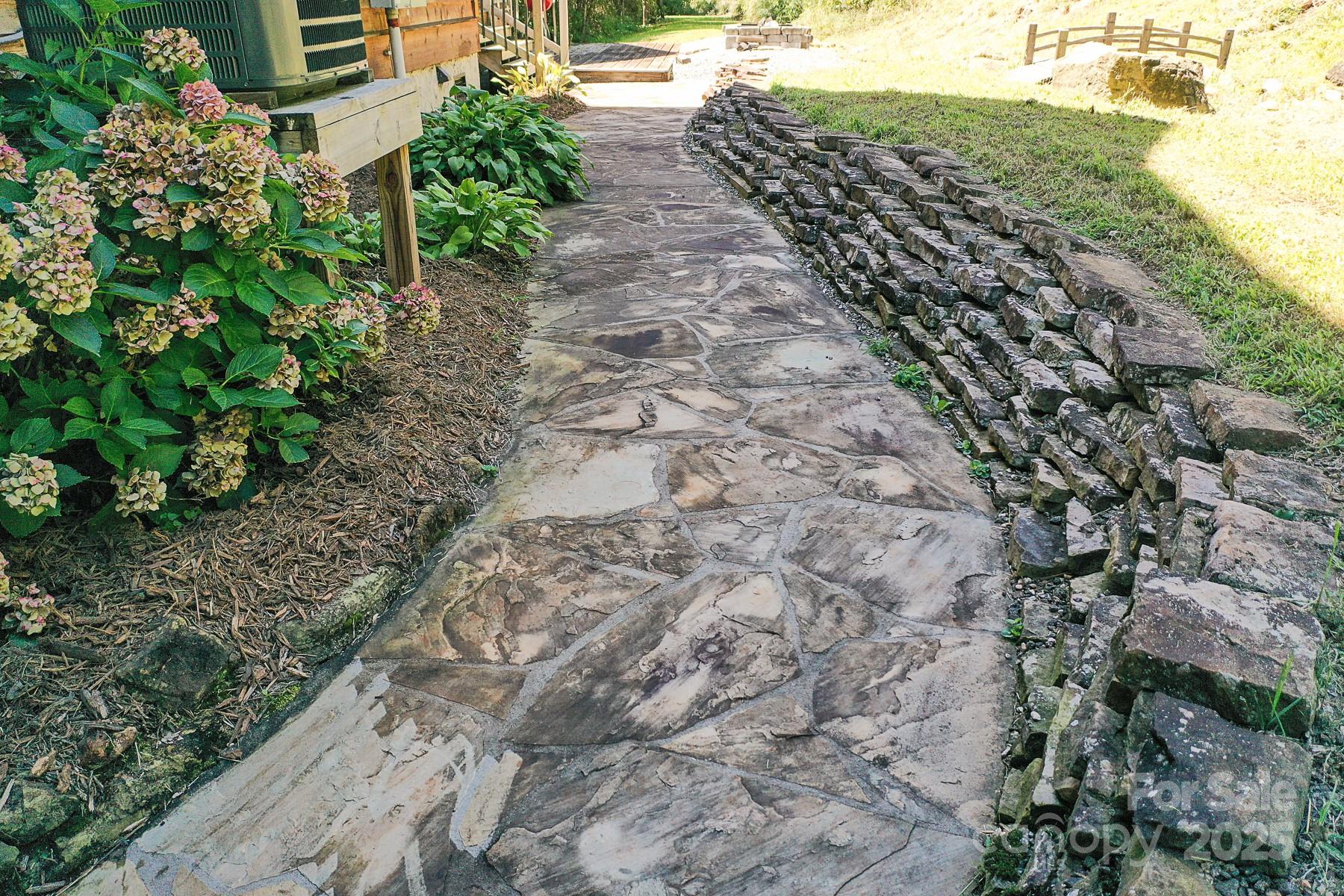1048 South River Road Sylva, NC 28779 - Photo 30 of 42 a view of a backyard with plants