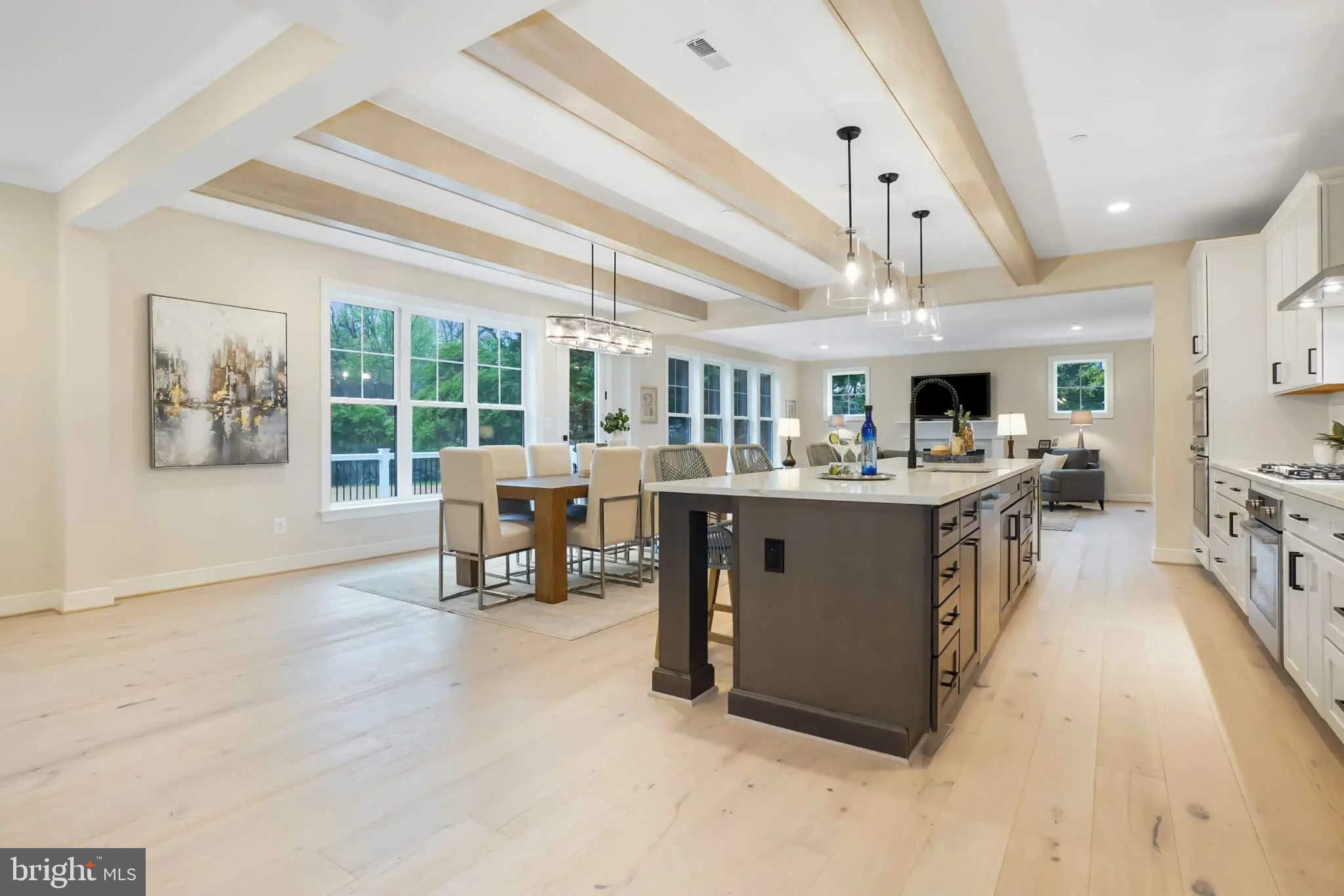 4617 Saul Road Kensington, MD 20895 - Photo 4 of 8 a living room with stainless steel appliances kitchen island furniture and a large window