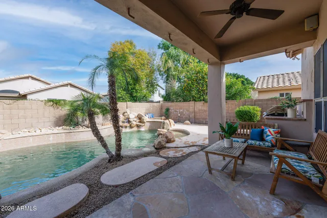 a view of a house with a backyard and garden