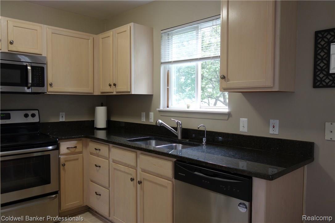 4941 South Crooks Road Royal Oak, MI 48073 - Photo 3 of 18 Newer remodeled Kitchen with stainless steel appliances, granite counters and a pantry