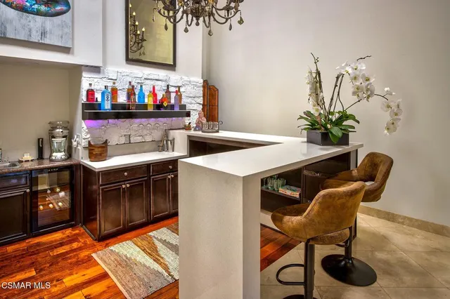 a kitchen with a table and chairs