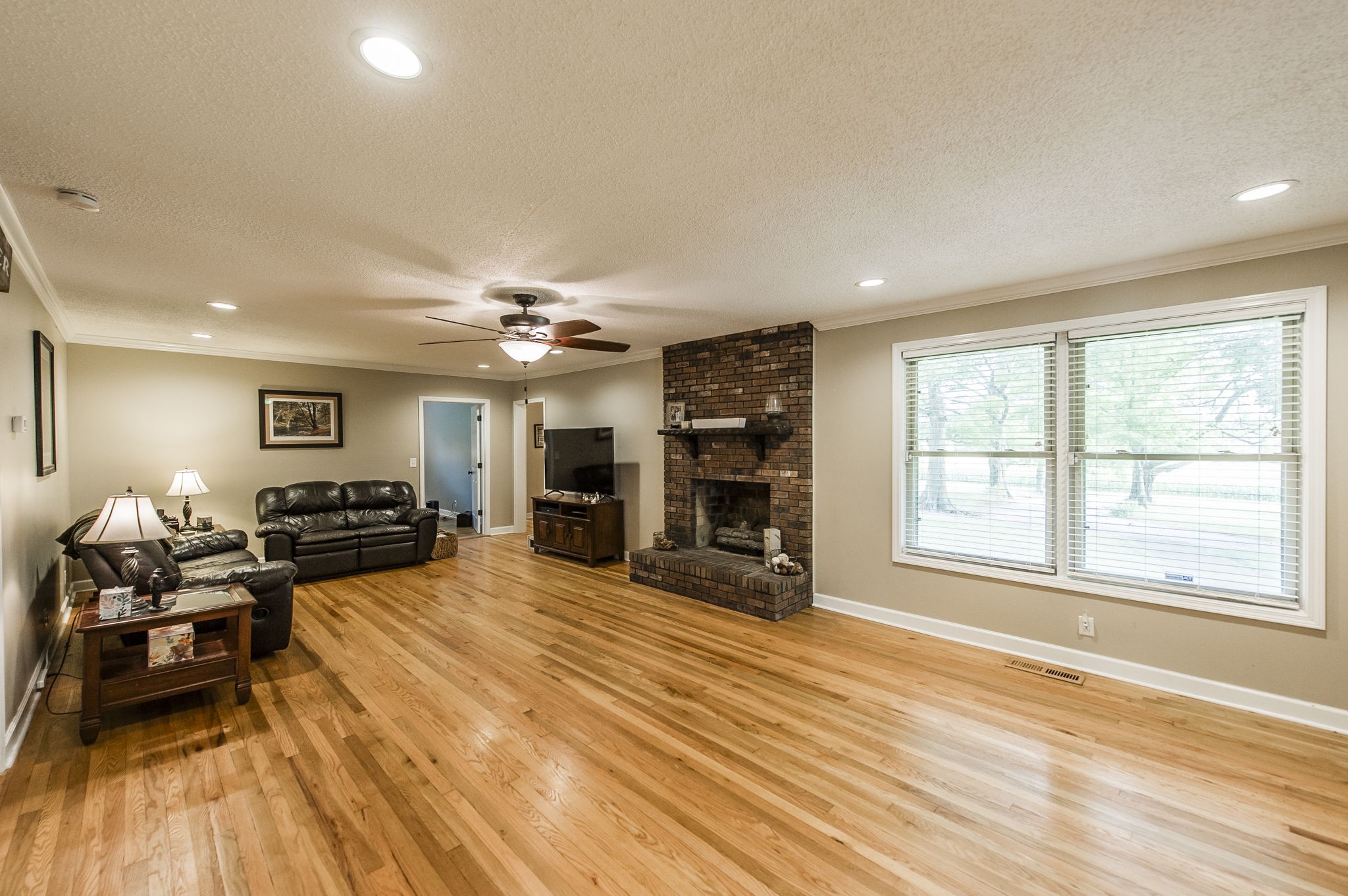 4131 Corbin Sneed Road Springfield, TN 37172 - Photo 14 of 52 a large room with wooden floor and furniture