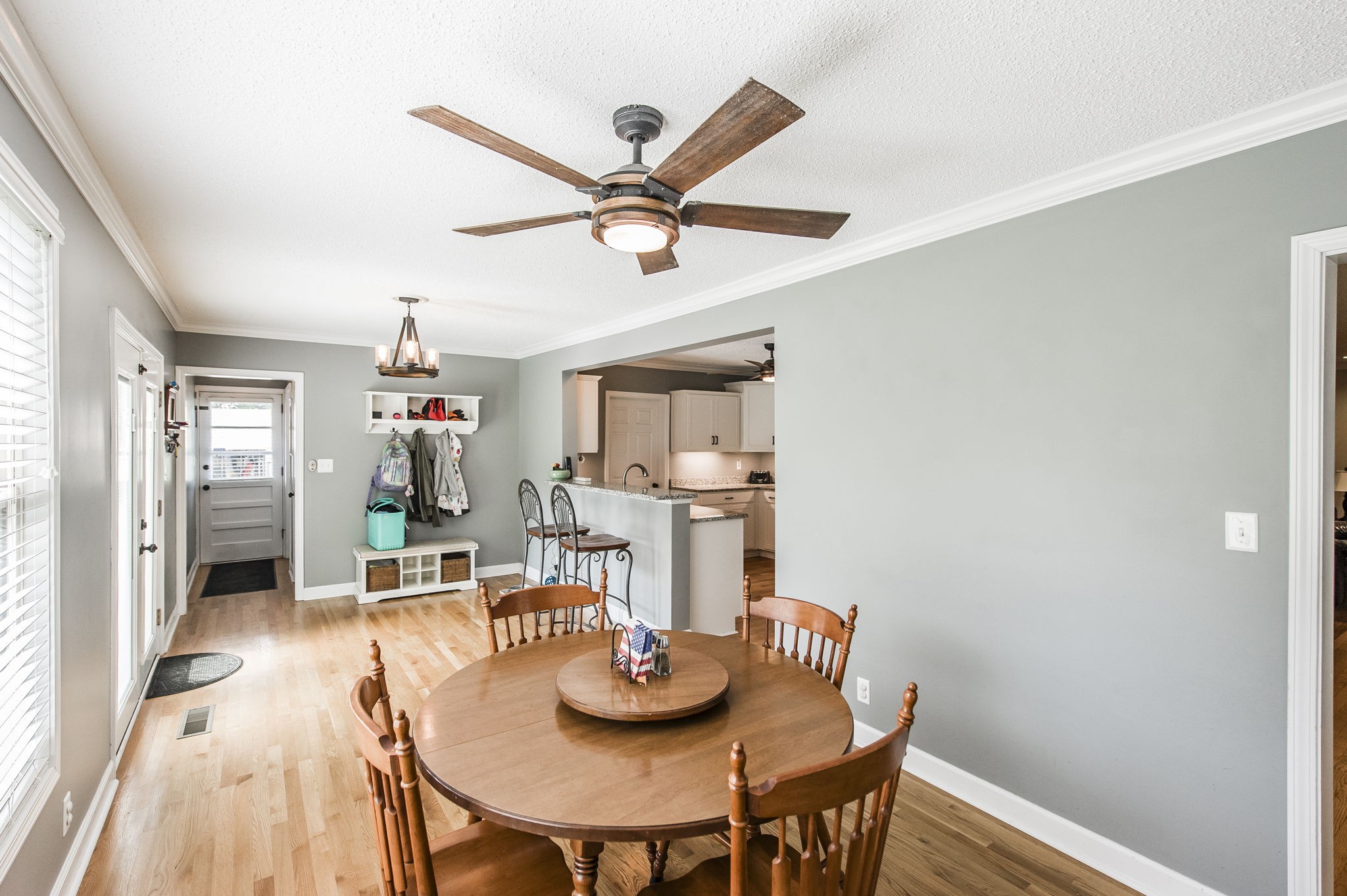 4131 Corbin Sneed Road Springfield, TN 37172 - Photo 19 of 52 a view of a dining room with furniture and a chandelier fan