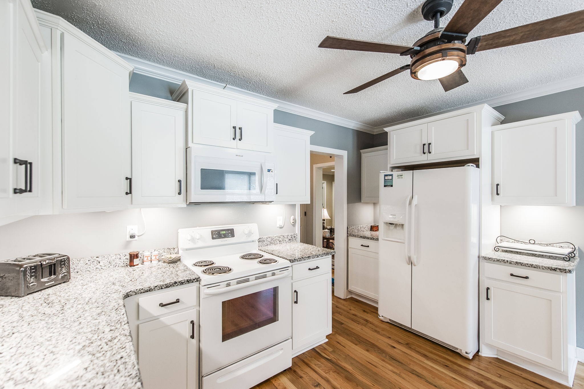 4131 Corbin Sneed Road Springfield, TN 37172 - Photo 23 of 52 a kitchen with white cabinets and white appliances