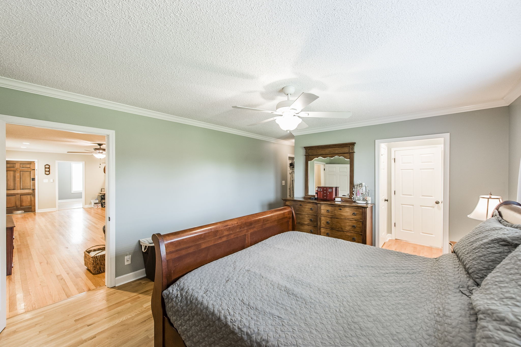 4131 Corbin Sneed Road Springfield, TN 37172 - Photo 27 of 52 a bedroom with a large bed and chandelier