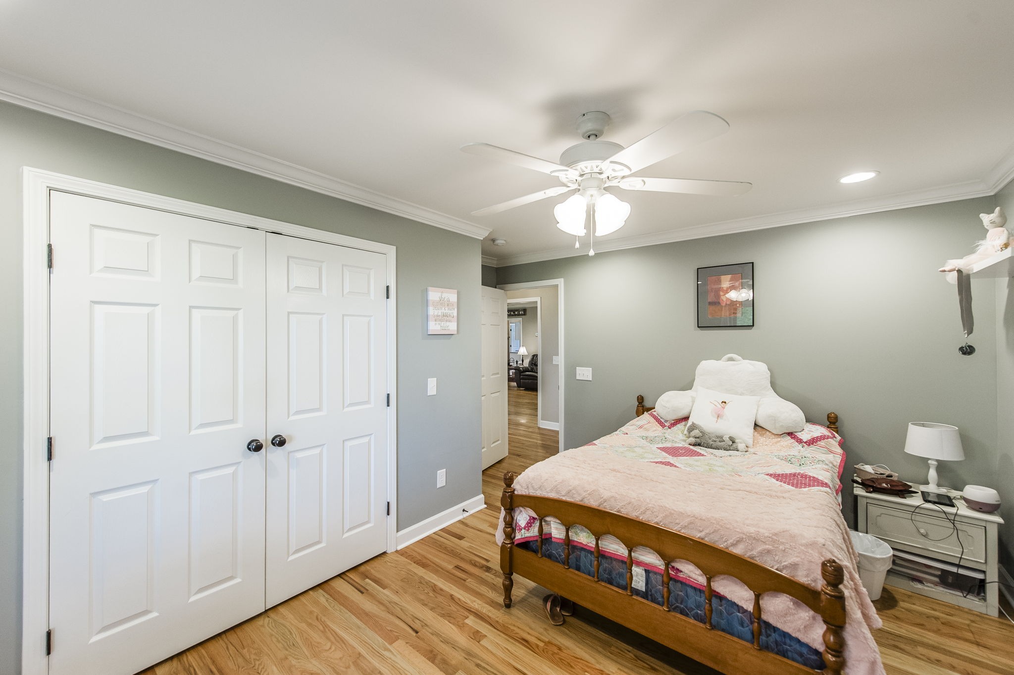 4131 Corbin Sneed Road Springfield, TN 37172 - Photo 35 of 52 a bedroom with a bed and a chandelier