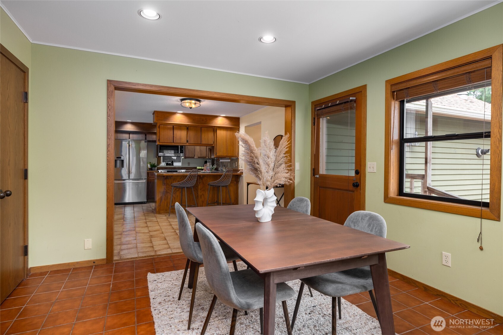 2496 Yew Street Road Bellingham, WA 98229 - Photo 15 of 38 a view of a dining room with furniture and window