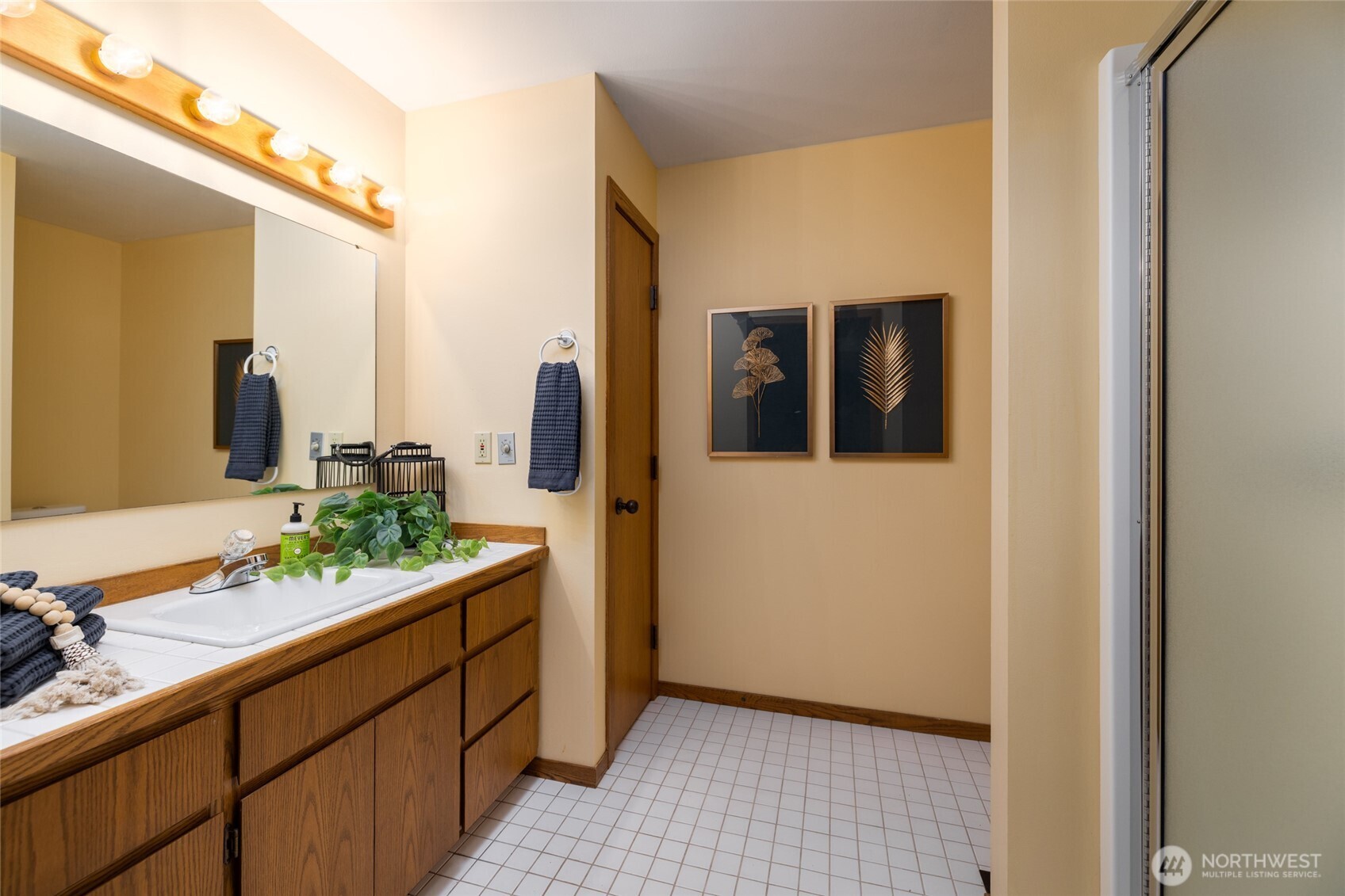 2496 Yew Street Road Bellingham, WA 98229 - Photo 17 of 38 a bathroom with a sink and mirror