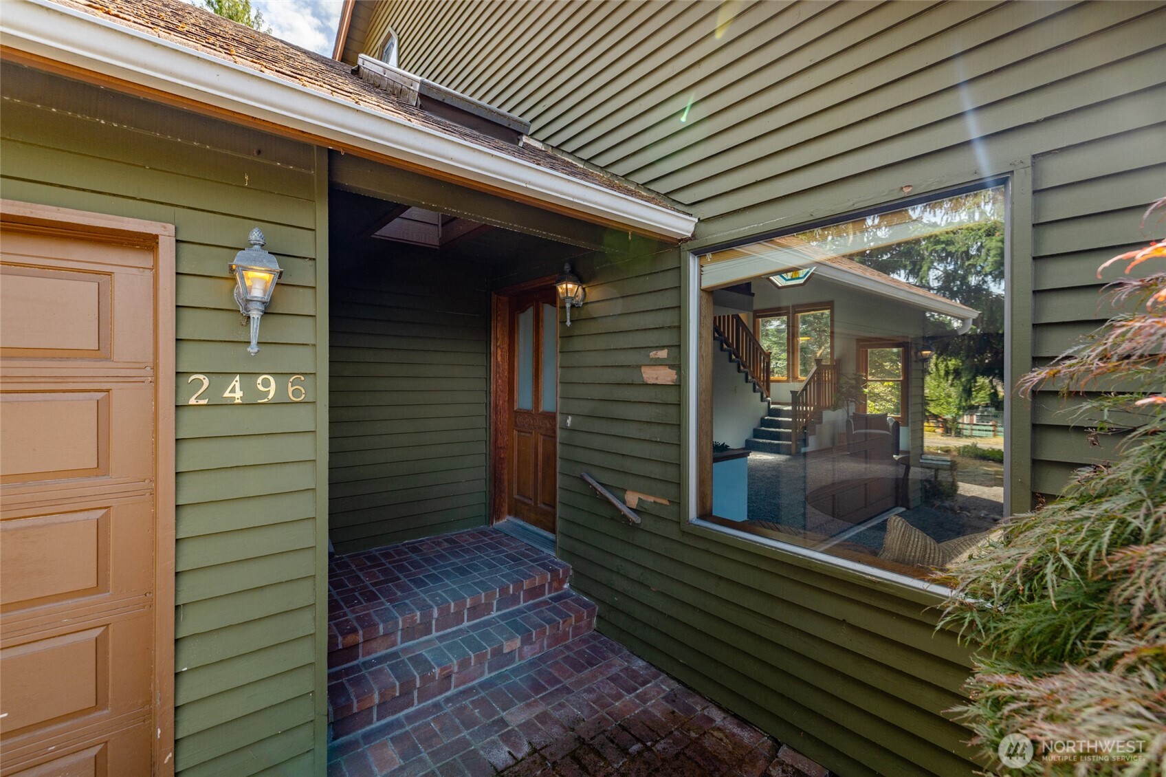 2496 Yew Street Road Bellingham, WA 98229 - Photo 2 of 38 a porch with seating space