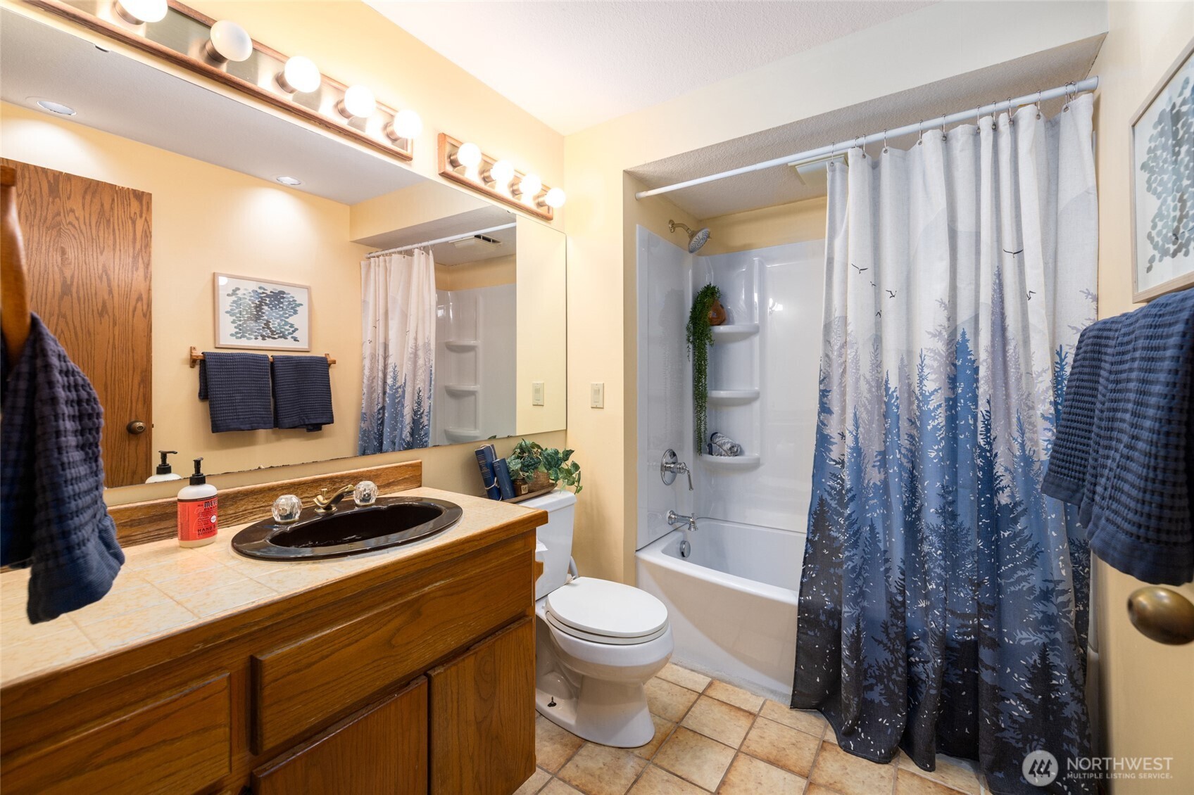 2496 Yew Street Road Bellingham, WA 98229 - Photo 23 of 38 a bathroom with a granite countertop sink toilet a mirror and shower