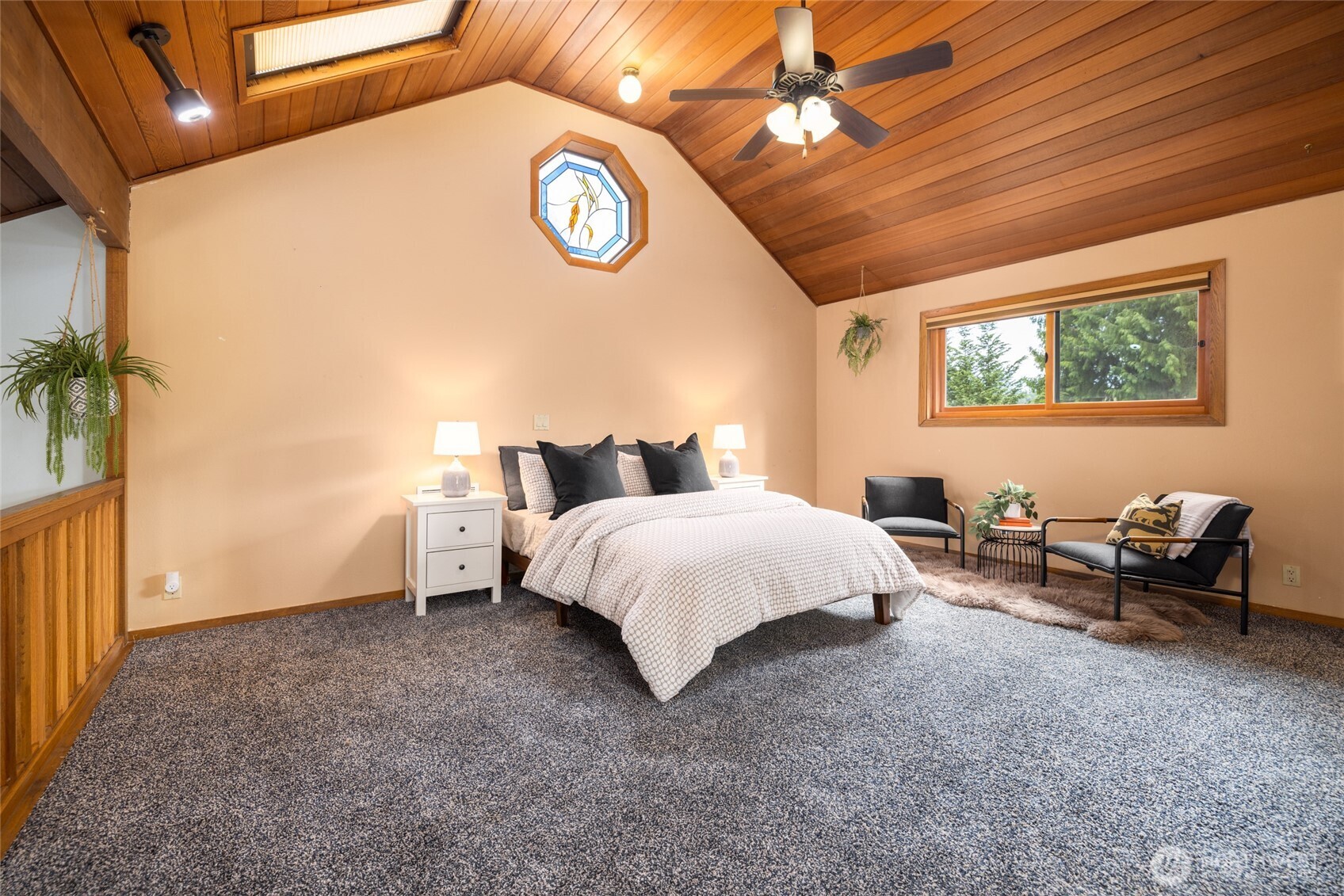 2496 Yew Street Road Bellingham, WA 98229 - Photo 25 of 38 a bed room with a bed and a chair