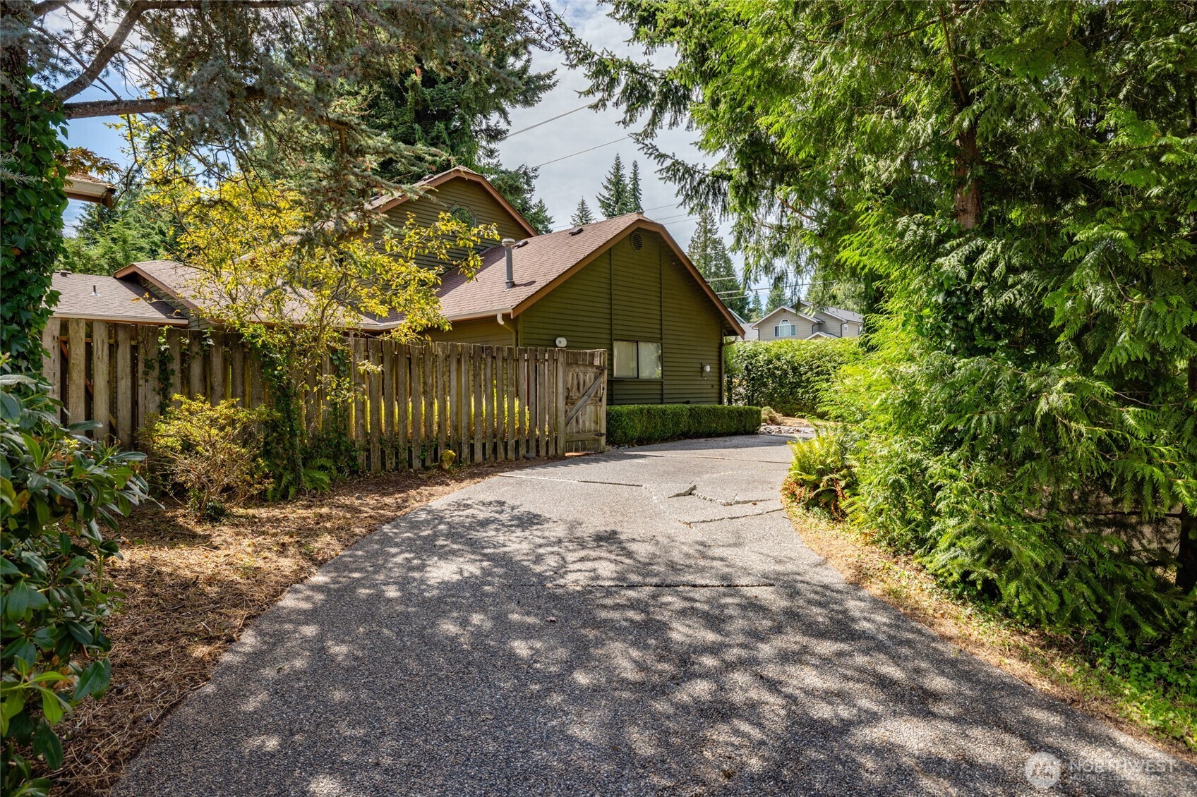 2496 Yew Street Road Bellingham, WA 98229 - Photo 31 of 38 a front view of a house with a yard and tree