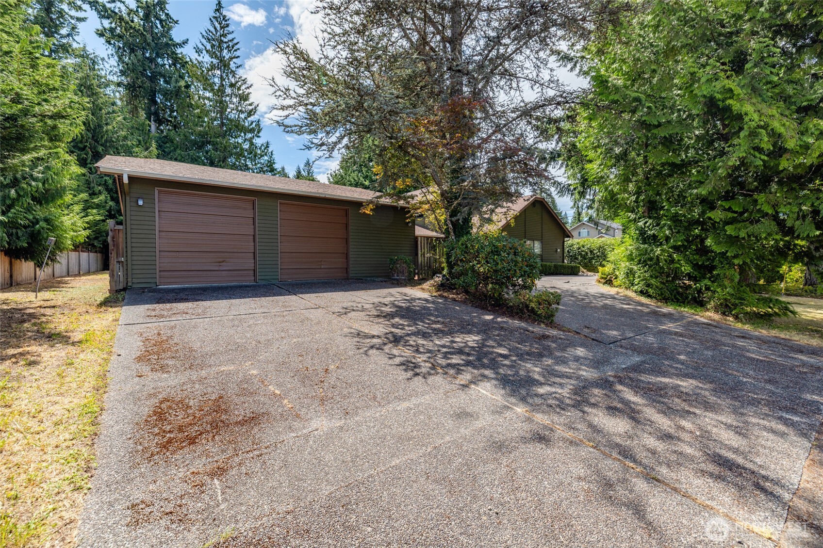 2496 Yew Street Road Bellingham, WA 98229 - Photo 32 of 38 a view of a house with a yard and garage