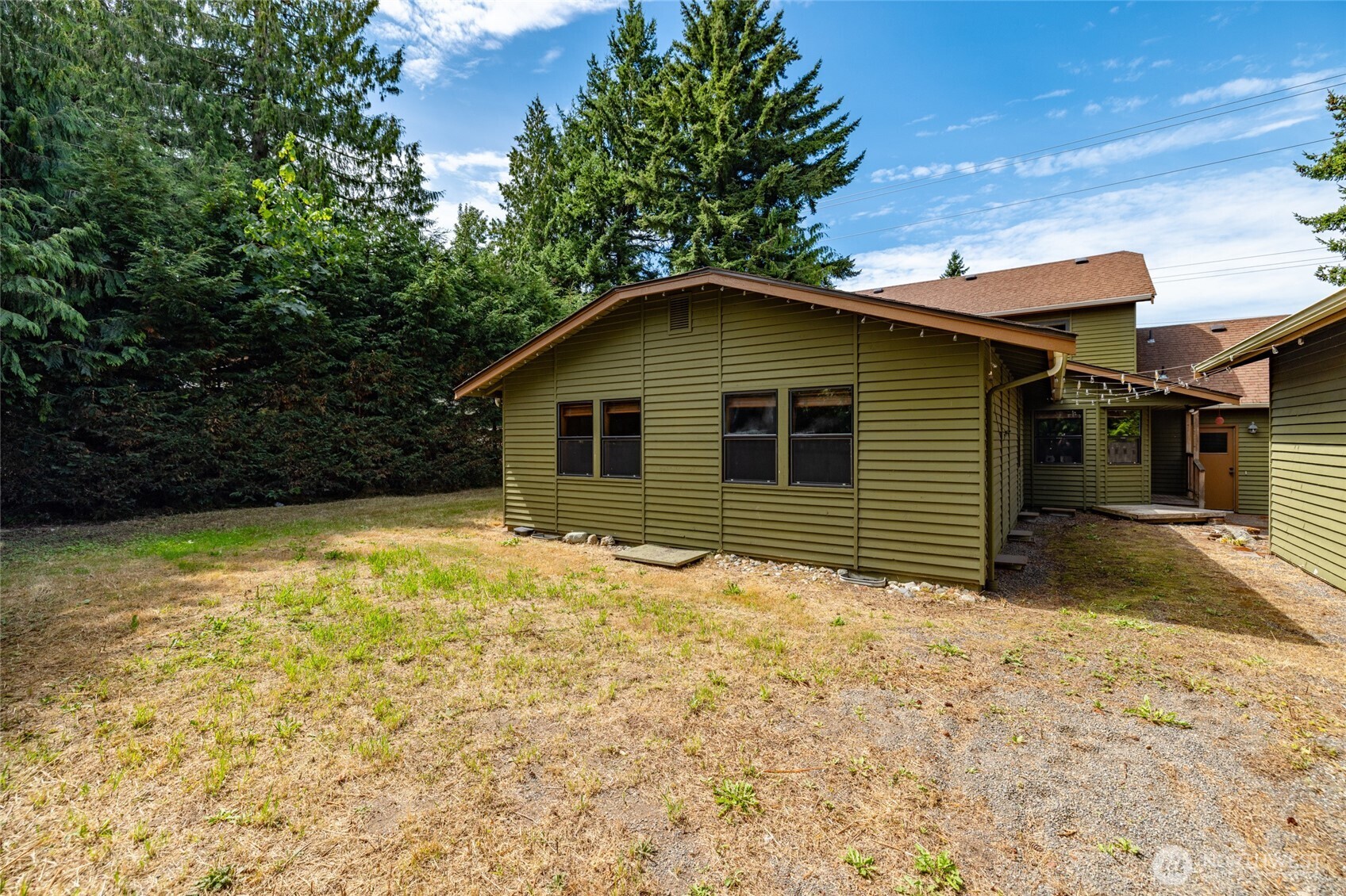 2496 Yew Street Road Bellingham, WA 98229 - Photo 33 of 38 a house with trees in the background