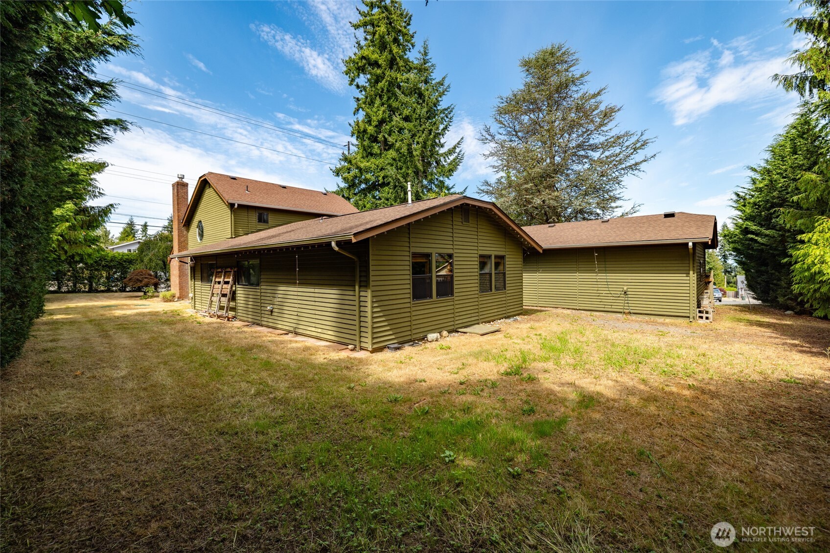 2496 Yew Street Road Bellingham, WA 98229 - Photo 34 of 38 a view of house with backyard space and garden