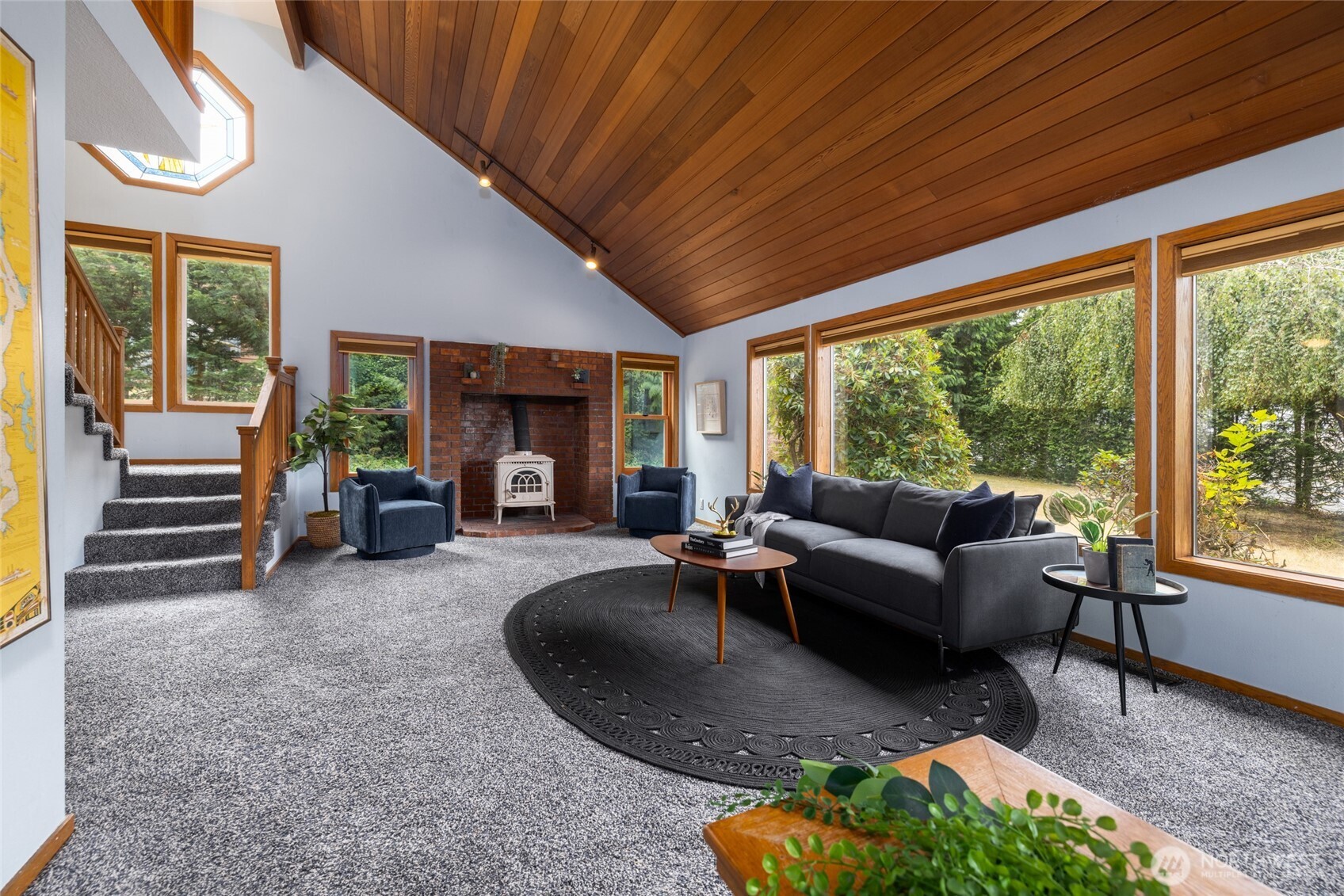 2496 Yew Street Road Bellingham, WA 98229 - Photo 4 of 38 a living room with furniture and a fireplace