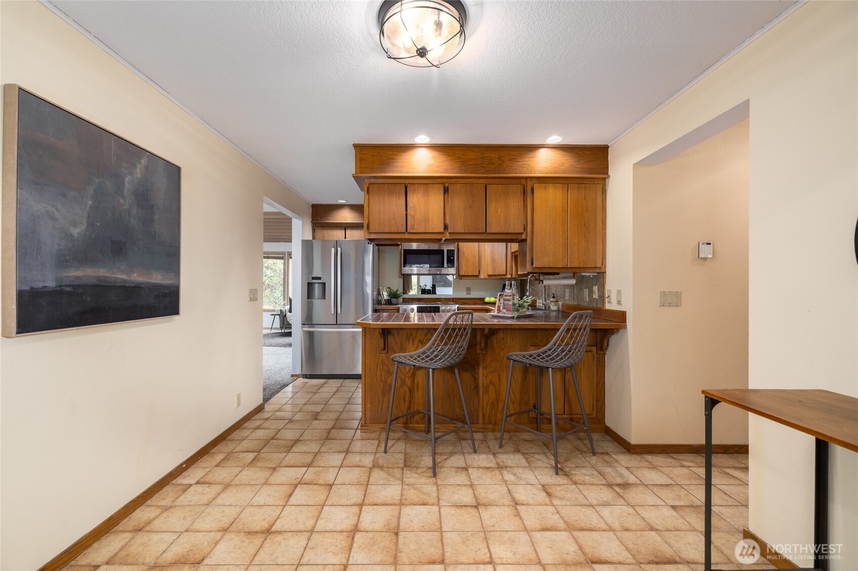 2496 Yew Street Road Bellingham, WA 98229 - Photo 10 of 38 a kitchen with stainless steel appliances a sink and a refrigerator