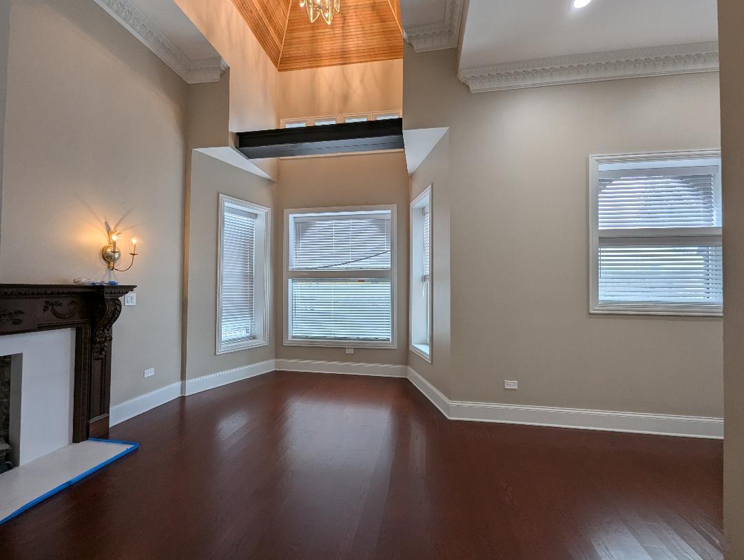 2150 West Monroe Street Chicago, IL 60612 - Photo 51 of 107 a view of an empty room with wooden floor and a window