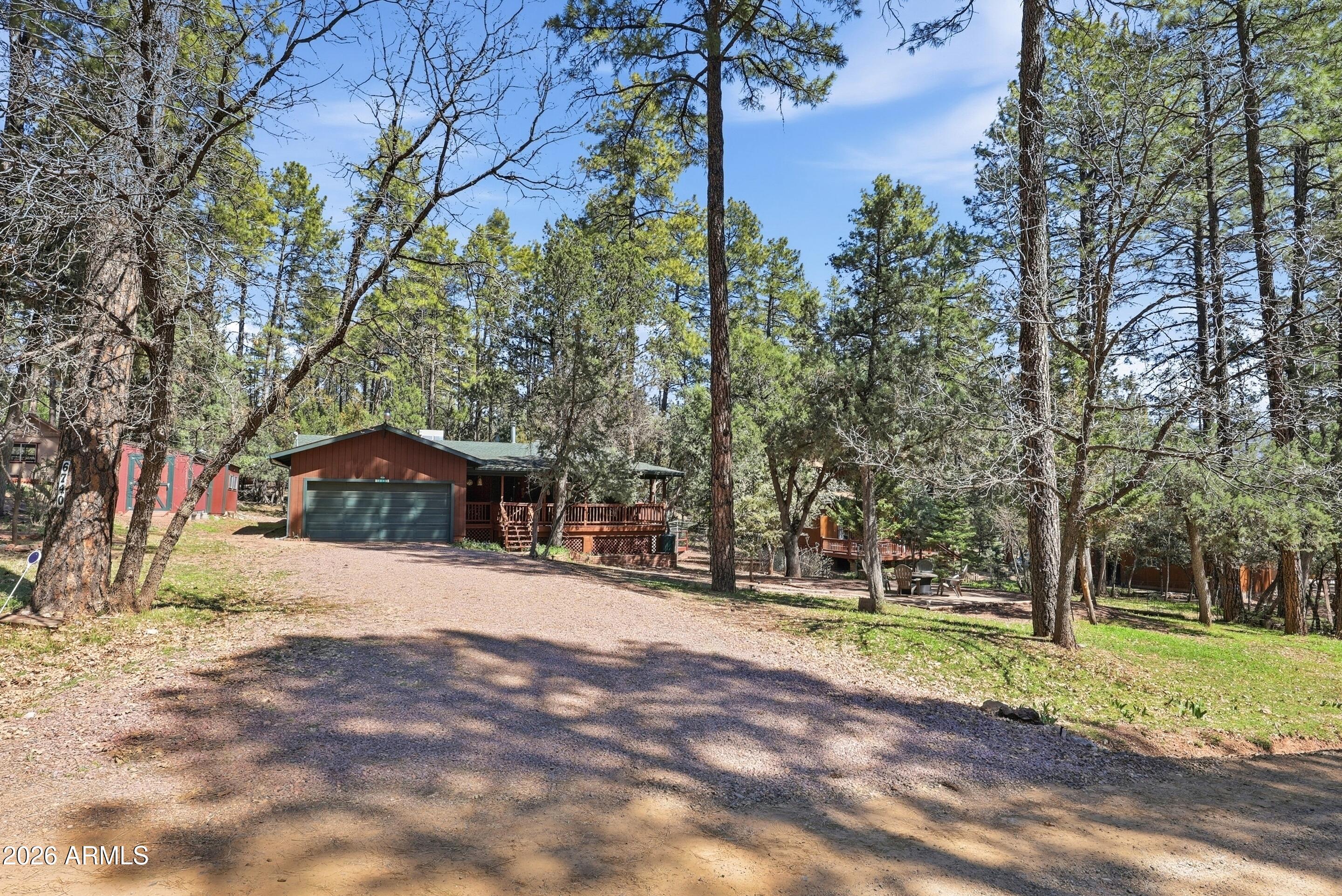 6740 Ridge Road Pine, AZ 85544 - Photo 35 of 35 a front view of a house with a yard and trees
