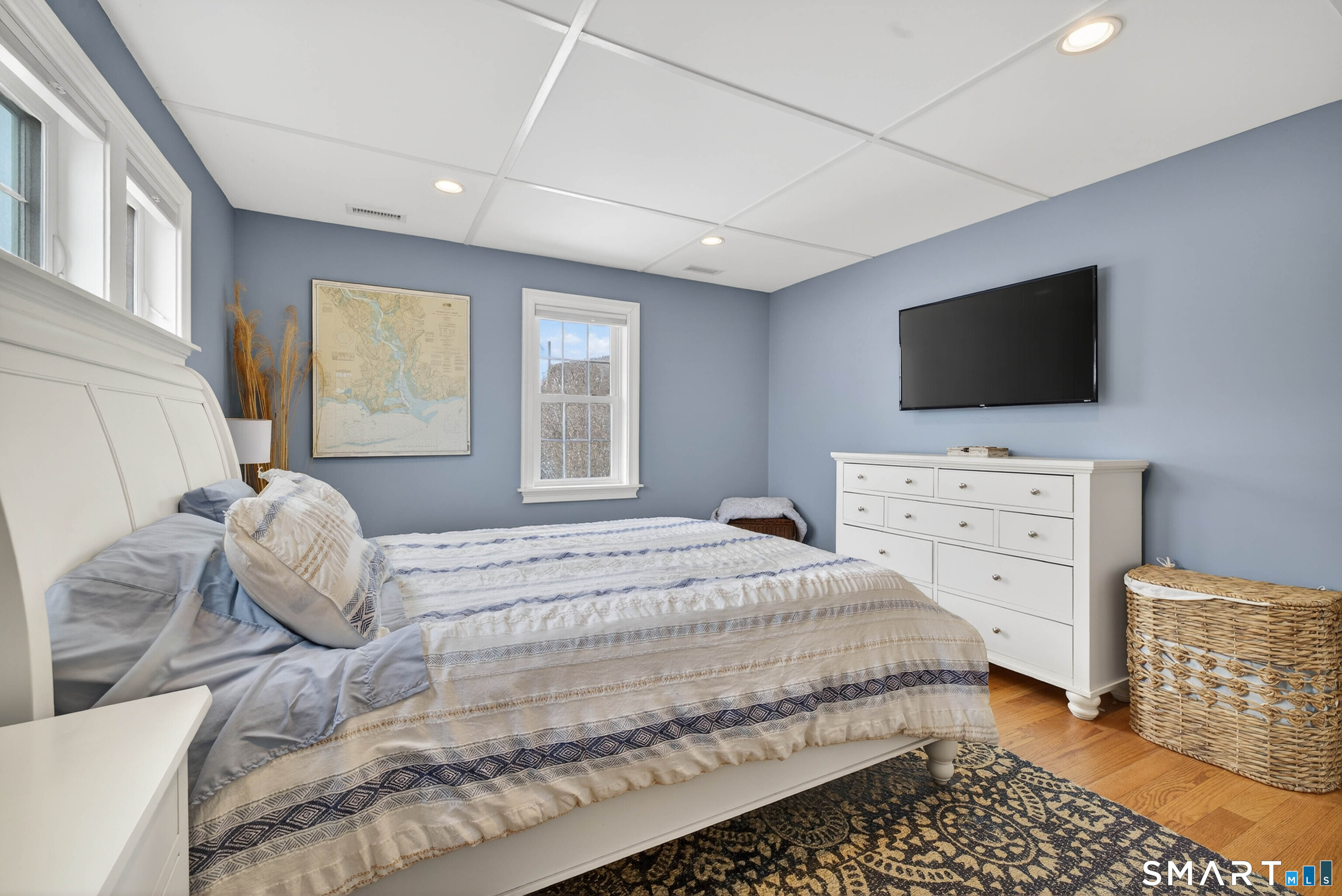 2 Pequot Trail Old Saybrook, CT 06475 - Photo 17 of 37 a bedroom with a bed and a flat screen tv