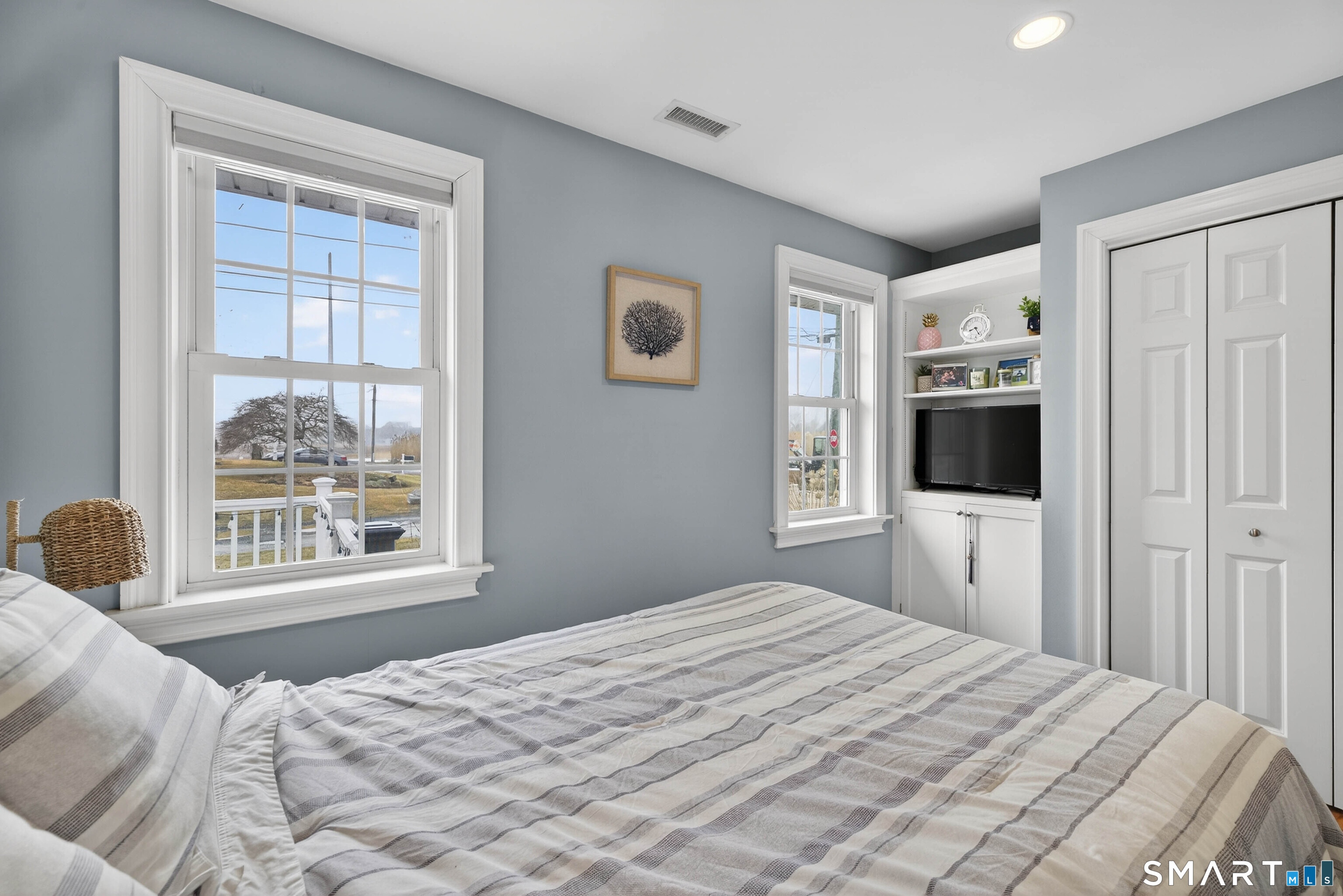 2 Pequot Trail Old Saybrook, CT 06475 - Photo 22 of 37 a bedroom with a large bed and a window
