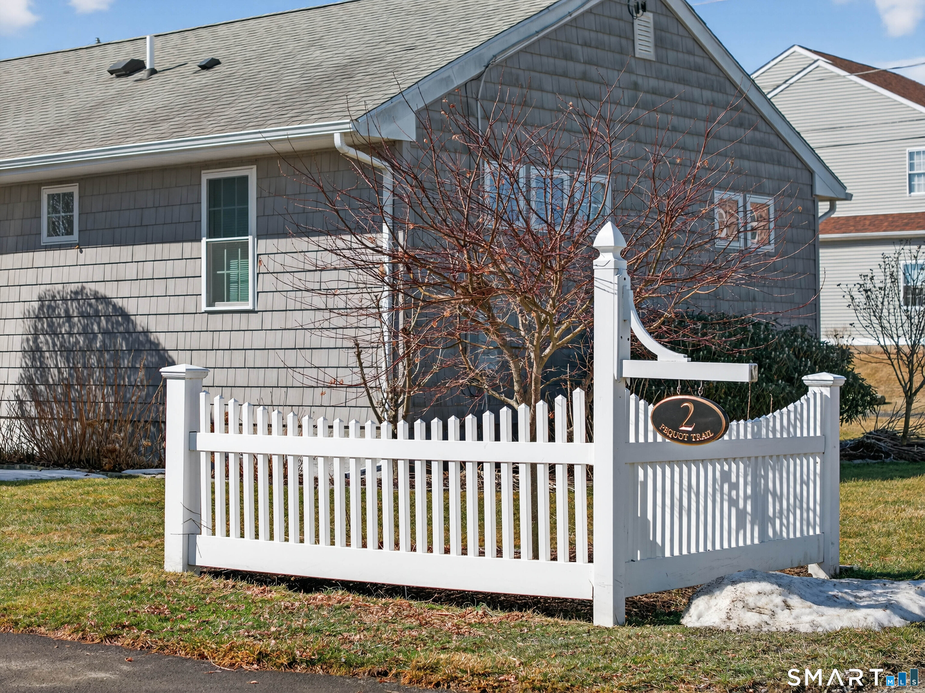 2 Pequot Trail Old Saybrook, CT 06475 - Photo 5 of 37 a front view of a house with a garden