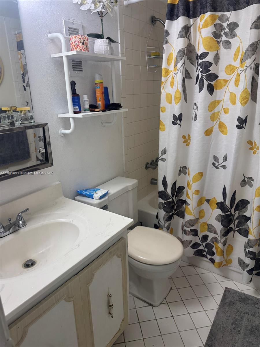 1975 West 44th Place, Unit 505 Hialeah, FL 33012 - Photo 27 of 28 a bathroom with a sink toilet and shower