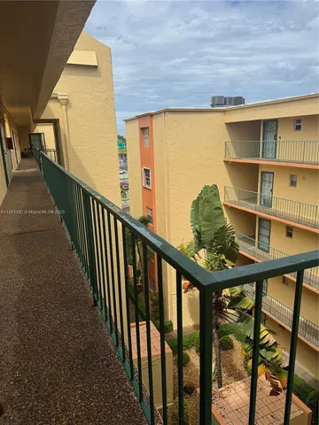 a view of swimming pool from a balcony