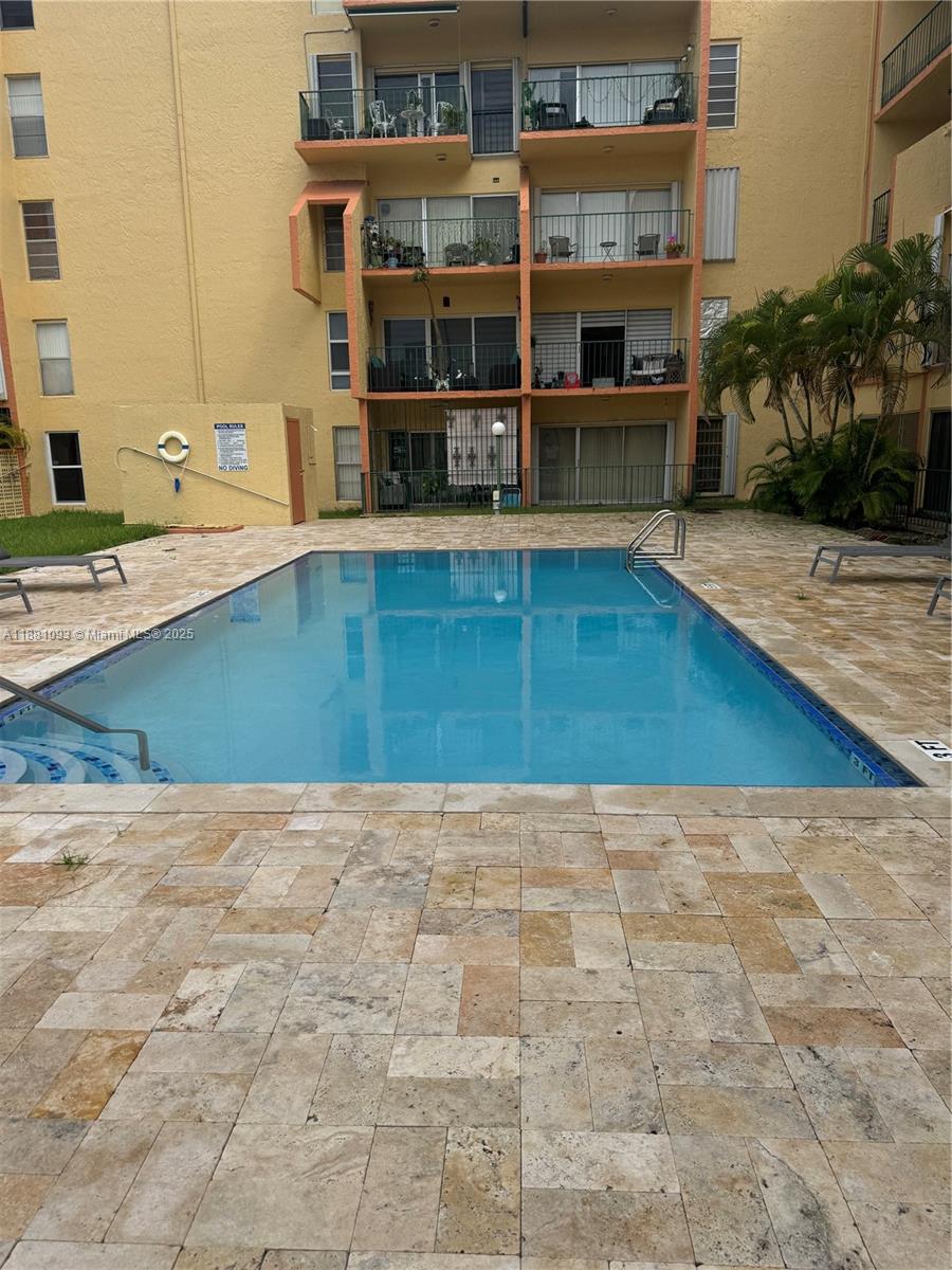 1975 West 44th Place, Unit 505 Hialeah, FL 33012 - Photo 6 of 28 a view of kitchen with cabinets and window