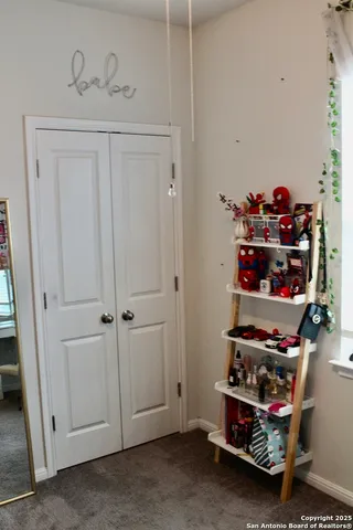 a view of room with lots of different colored cloths