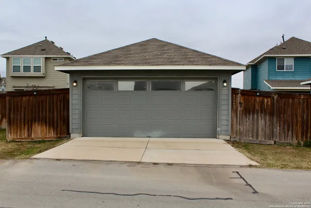 a front view of a house with a garage