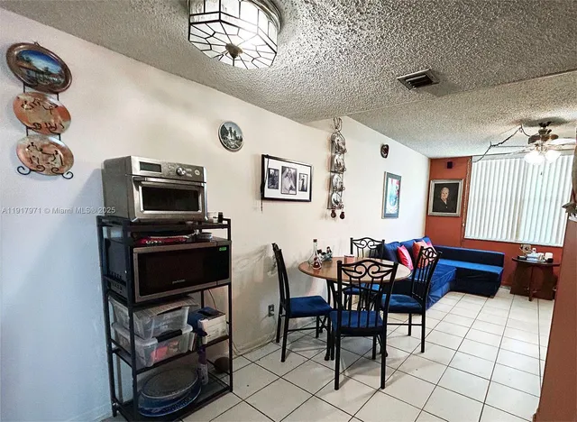 a view of a workspace with furniture