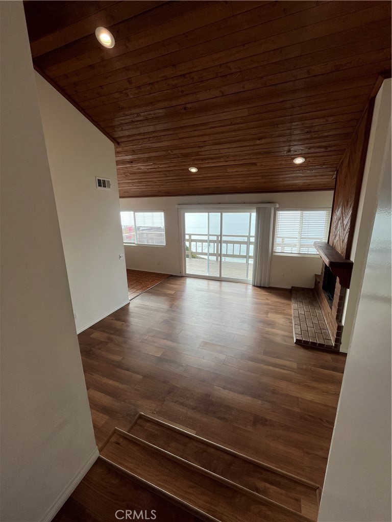 1532 Neptune Avenue Encinitas, CA 92024 - Photo 14 of 36 wooden floor in an empty room with a window