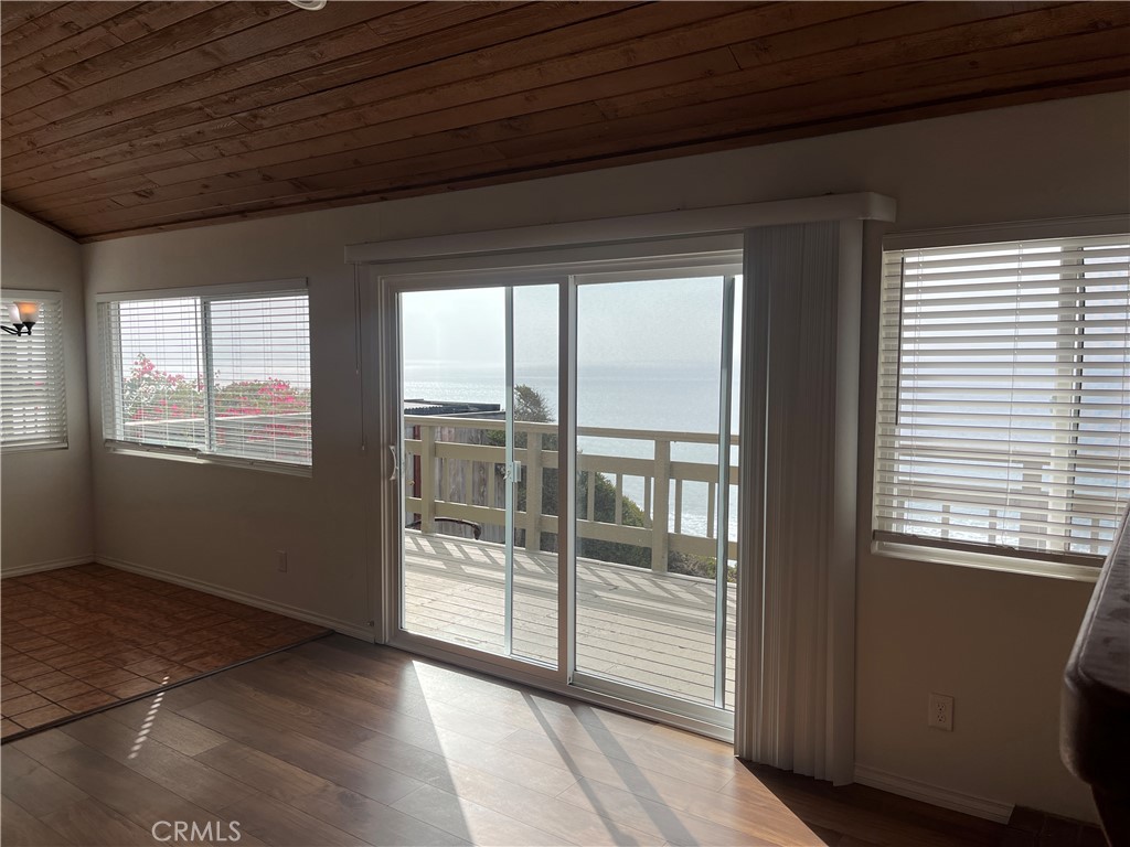 1532 Neptune Avenue Encinitas, CA 92024 - Photo 18 of 36 a view of an empty room with windows