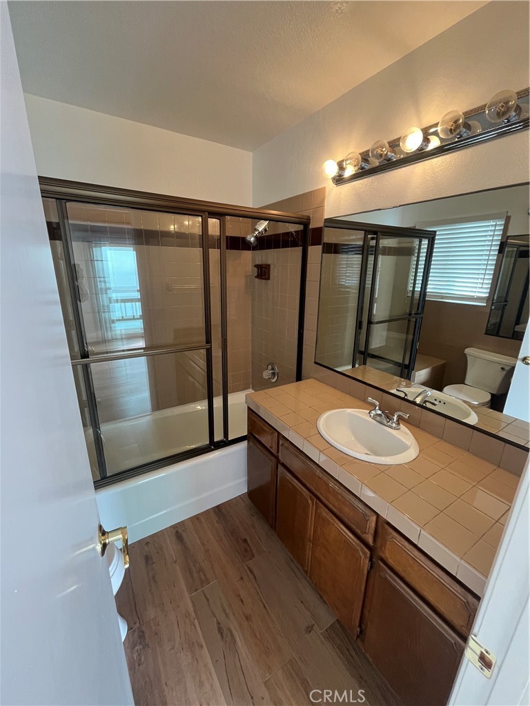 1532 Neptune Avenue Encinitas, CA 92024 - Photo 24 of 36 a bathroom with a sink and a mirror