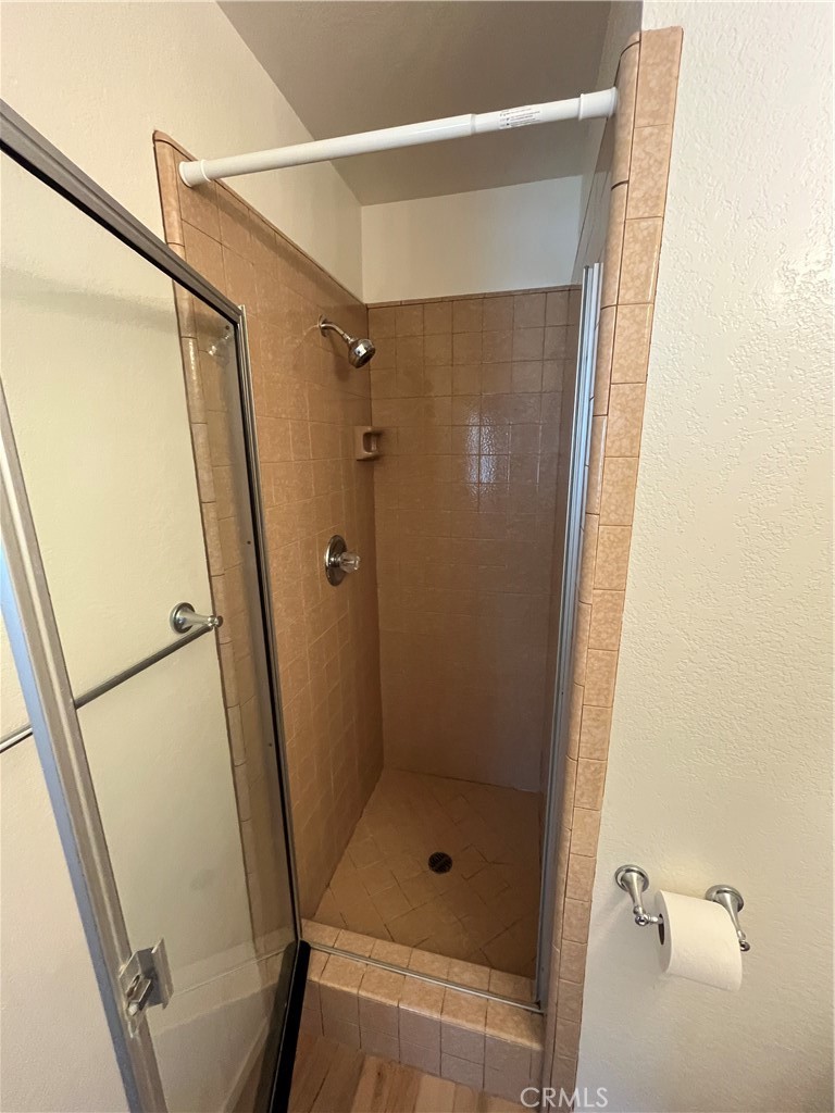 1532 Neptune Avenue Encinitas, CA 92024 - Photo 30 of 36 a bathroom with a glass door shower and a sink