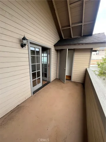a bathroom with a sink and mirror with toilet