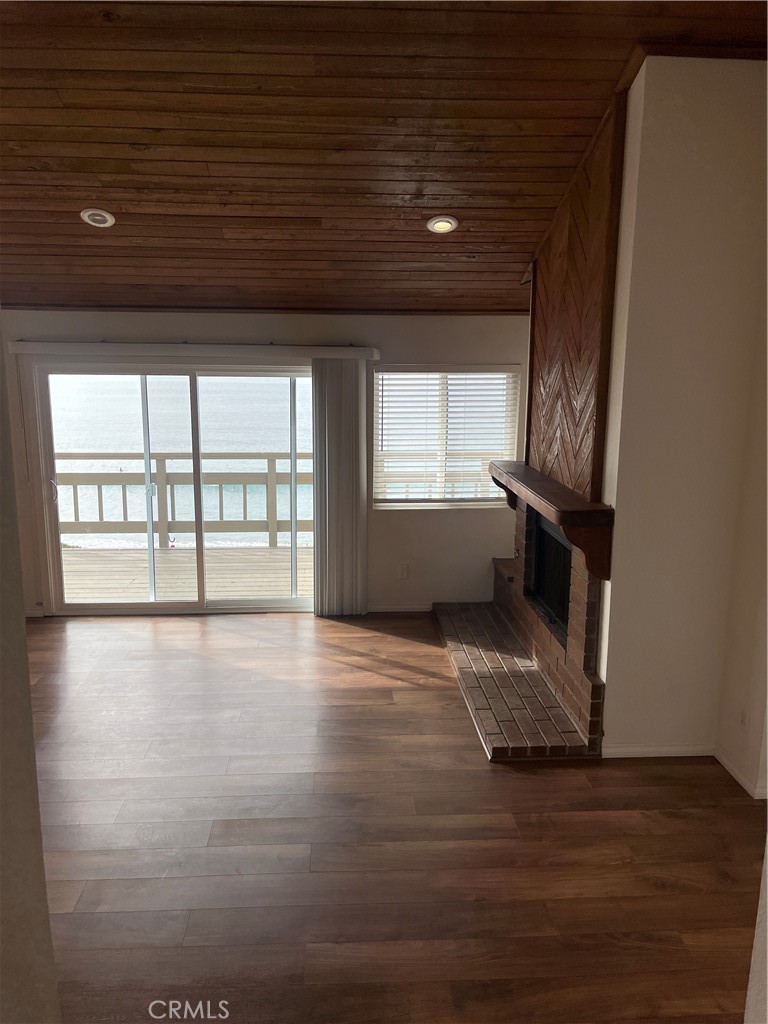 1532 Neptune Avenue Encinitas, CA 92024 - Photo 36 of 36 wooden floor in an empty room with a window