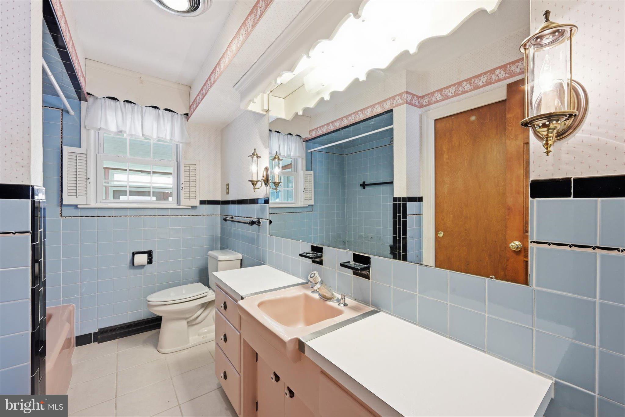535 South 6th Street Denver, PA 17517 - Photo 15 of 41 a bathroom with a sink a toilet and shower