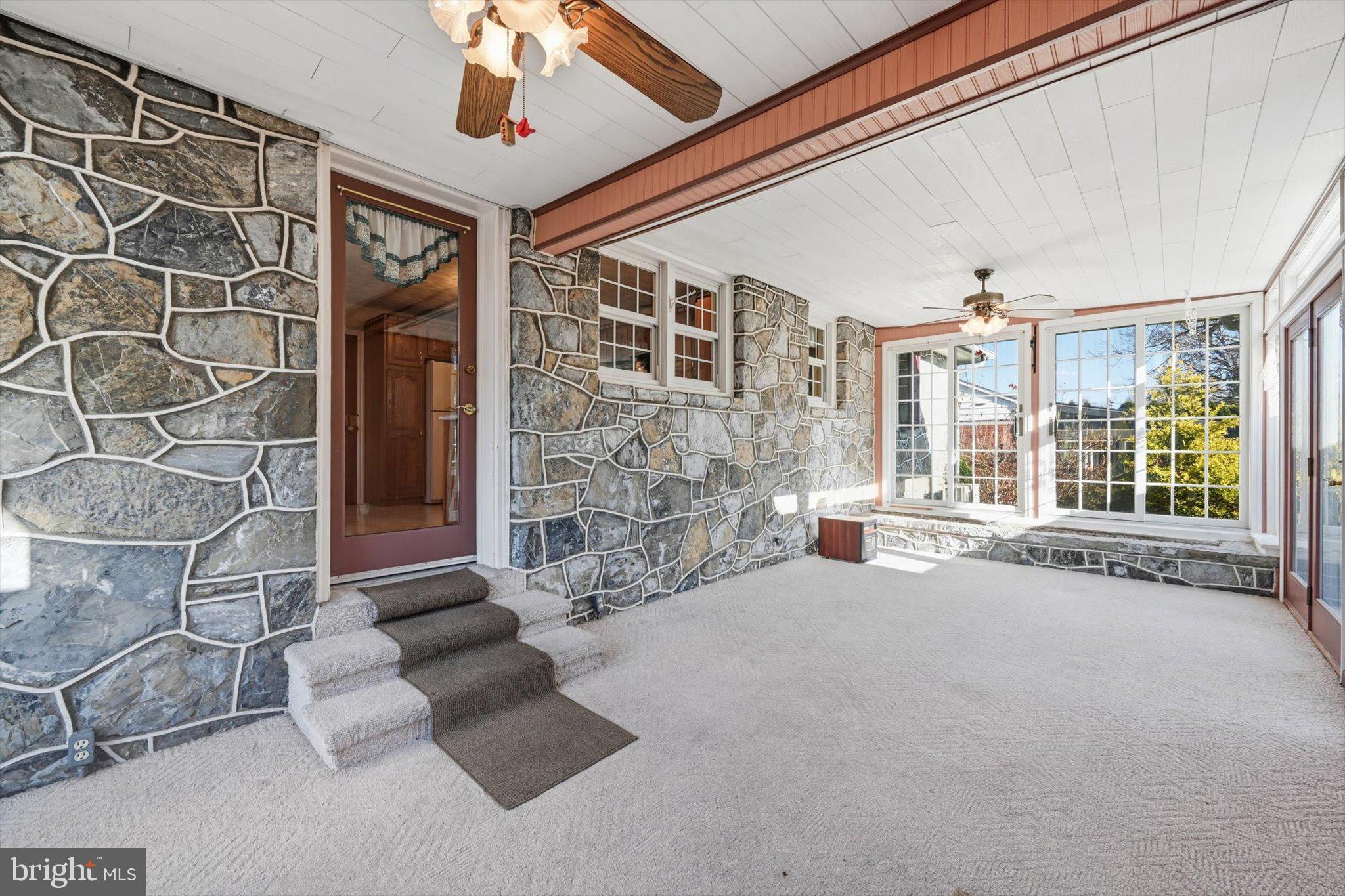 535 South 6th Street Denver, PA 17517 - Photo 9 of 41 a spacious bedroom with a large window and chandelier
