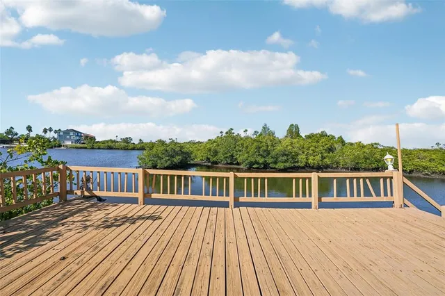 a view of a chairs and table in the balcony