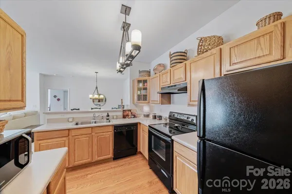 a spacious bathroom with a double vanity sink toilet and shower