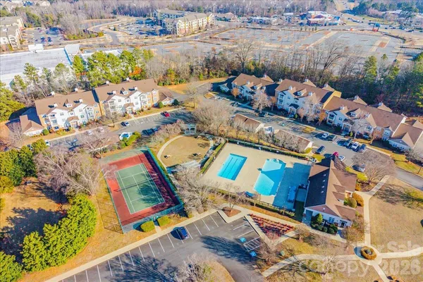 an aerial view of a house with a swimming pool