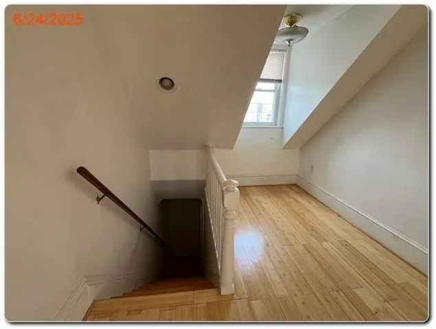 a view of entryway with wooden floor