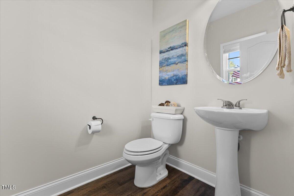 166 Old Field Loop Sanford, NC 27332 - Photo 22 of 50 a bathroom with a sink toilet and a mirror