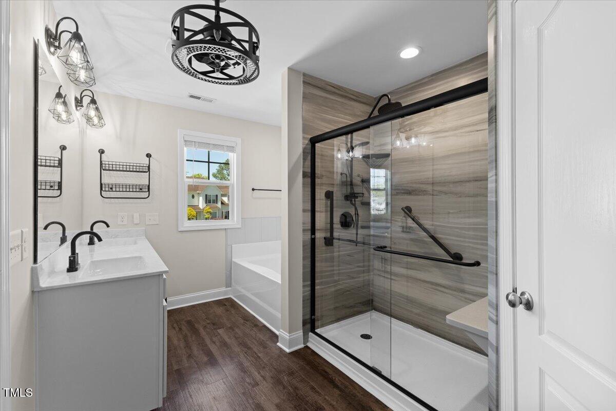 166 Old Field Loop Sanford, NC 27332 - Photo 28 of 50 a bathroom with a sink and mirror