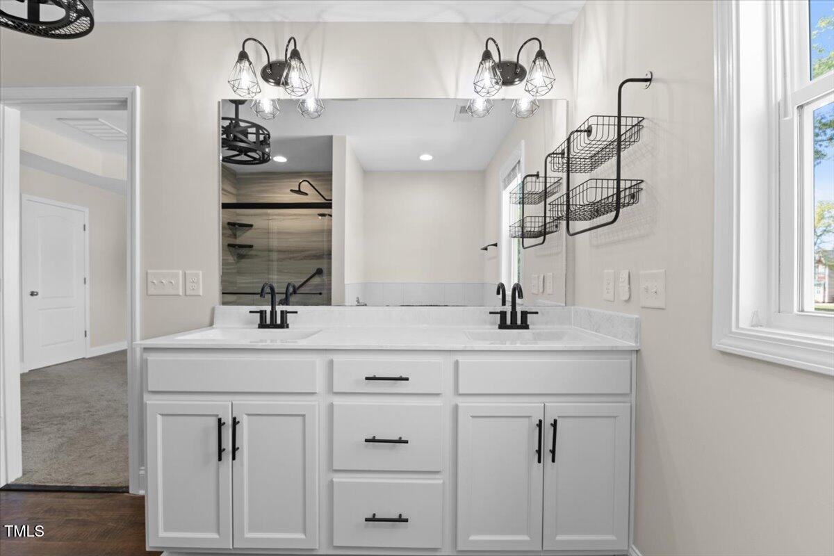 166 Old Field Loop Sanford, NC 27332 - Photo 29 of 50 a bathroom with a sink vanity and mirror
