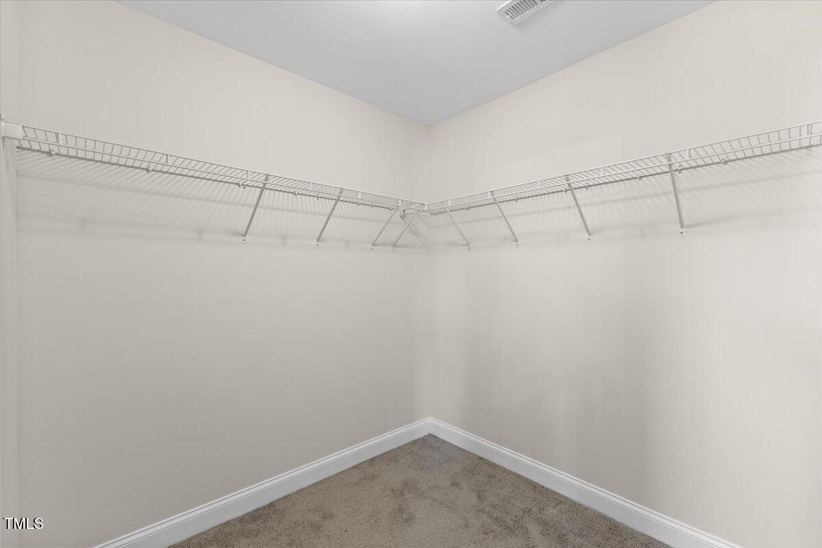 166 Old Field Loop Sanford, NC 27332 - Photo 31 of 50 a view of a room with racks on the wall