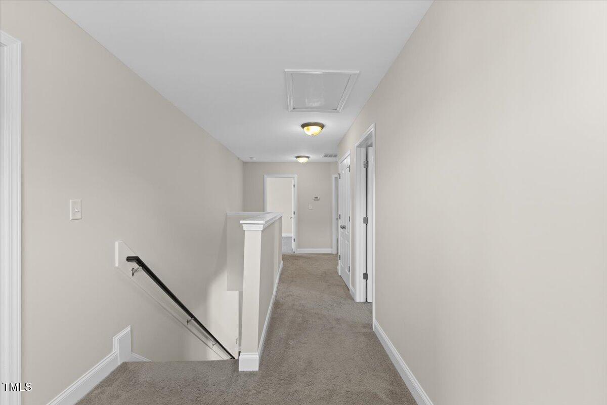 166 Old Field Loop Sanford, NC 27332 - Photo 32 of 50 a view of a hallway with white walls