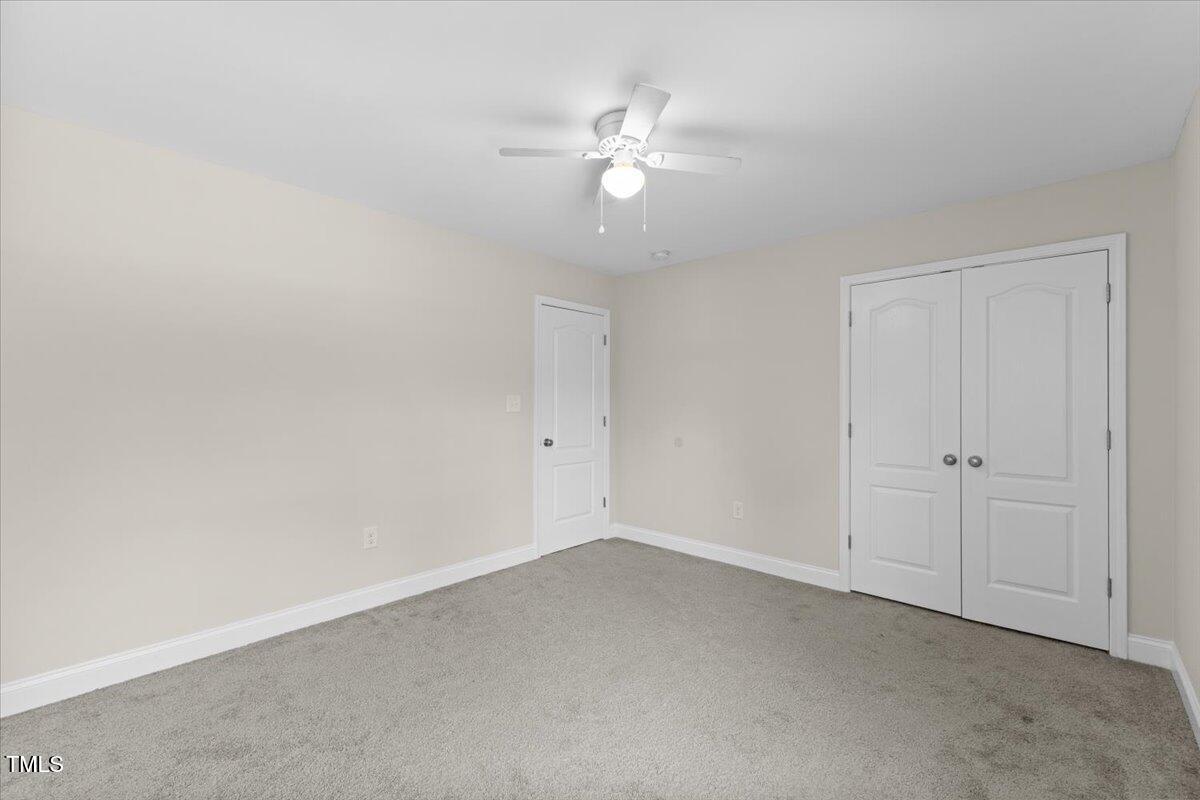 166 Old Field Loop Sanford, NC 27332 - Photo 34 of 50 a view of an empty room with a fan
